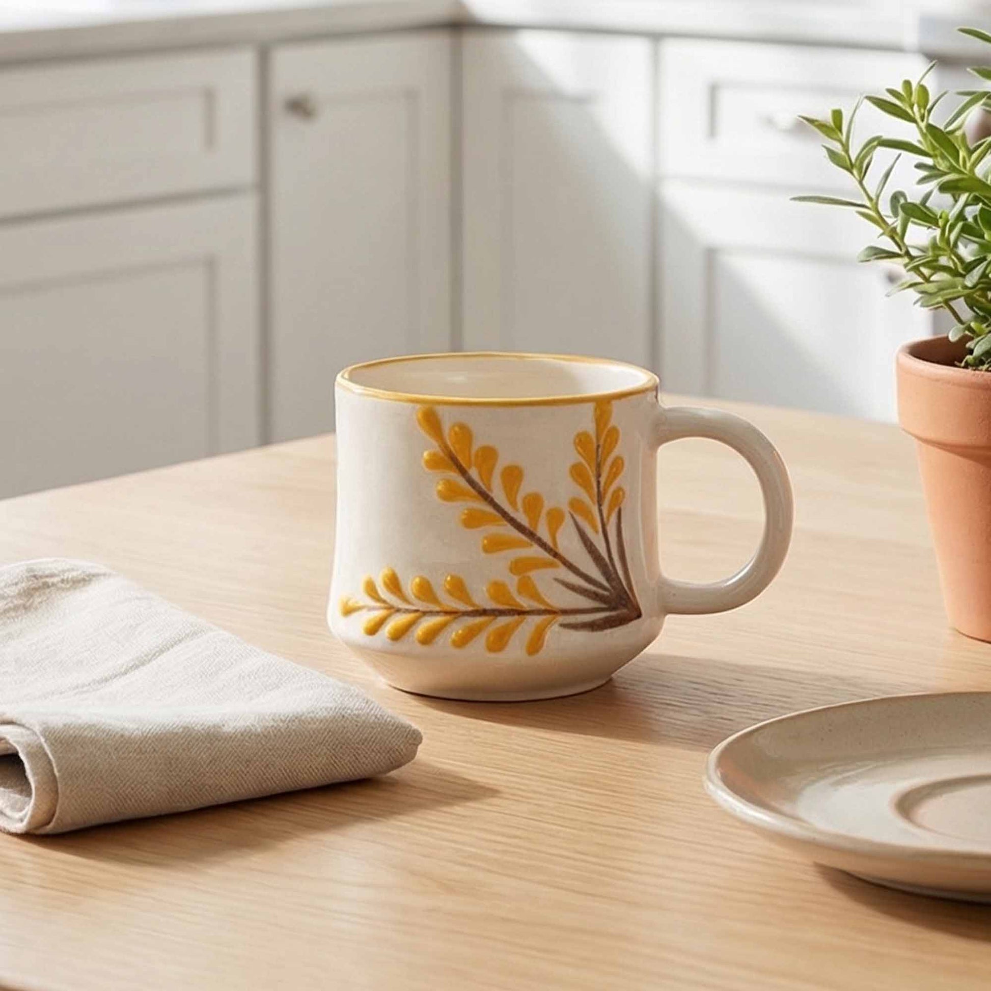 Decorative mug with floral design on a kitchen counter