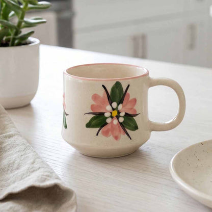 Ceramic mug with floral design on a kitchen counter
