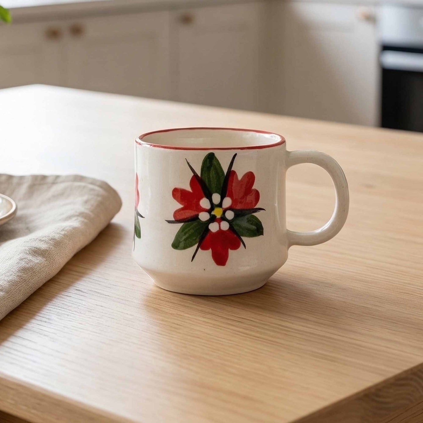 White mug with floral design on a wooden table