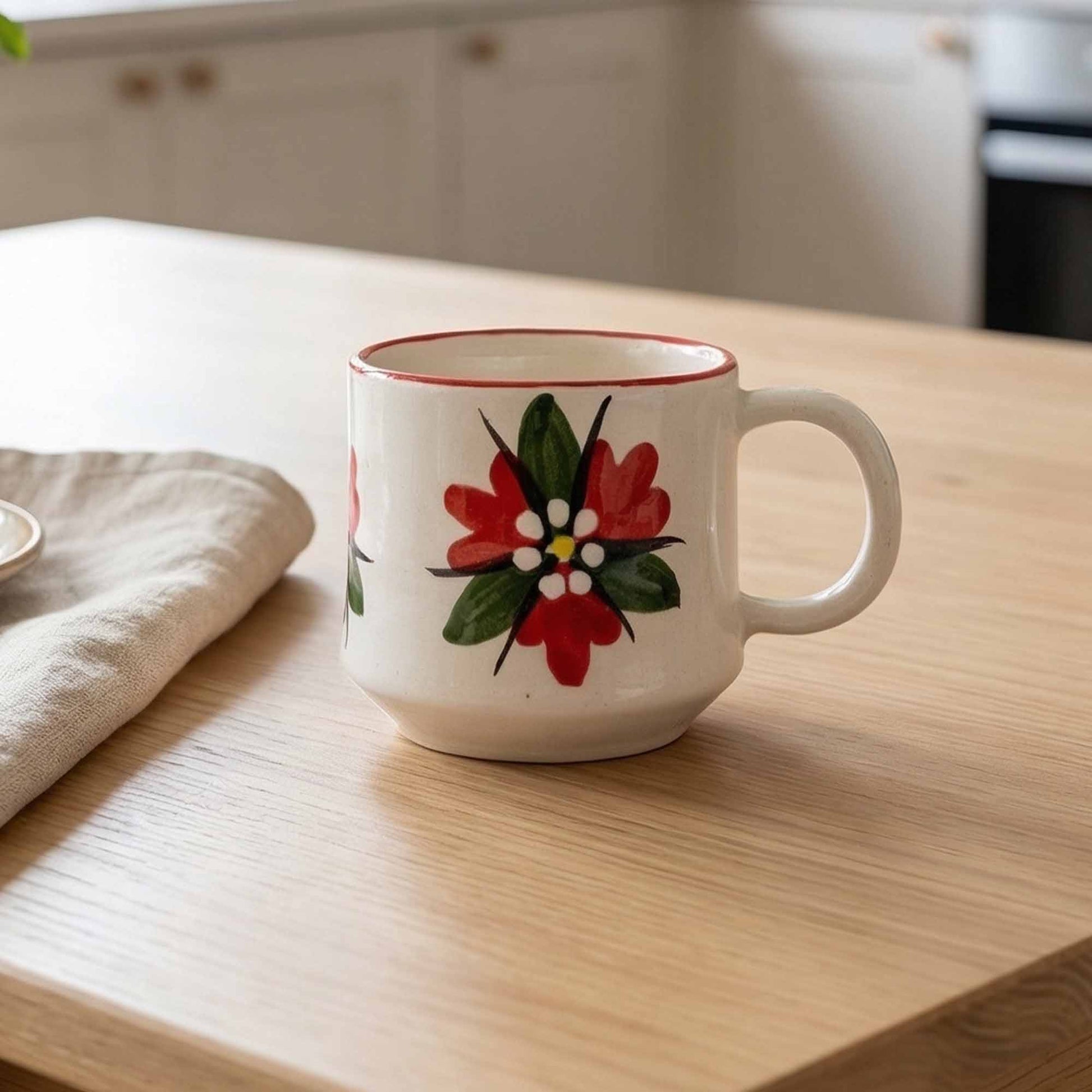 White mug with floral design on a wooden table