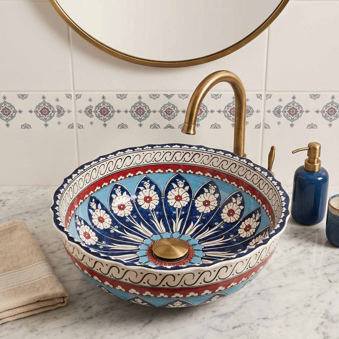 Decorative ceramic sink with floral patterns in a bathroom setting