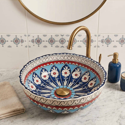 Decorative ceramic sink with floral patterns in a bathroom setting