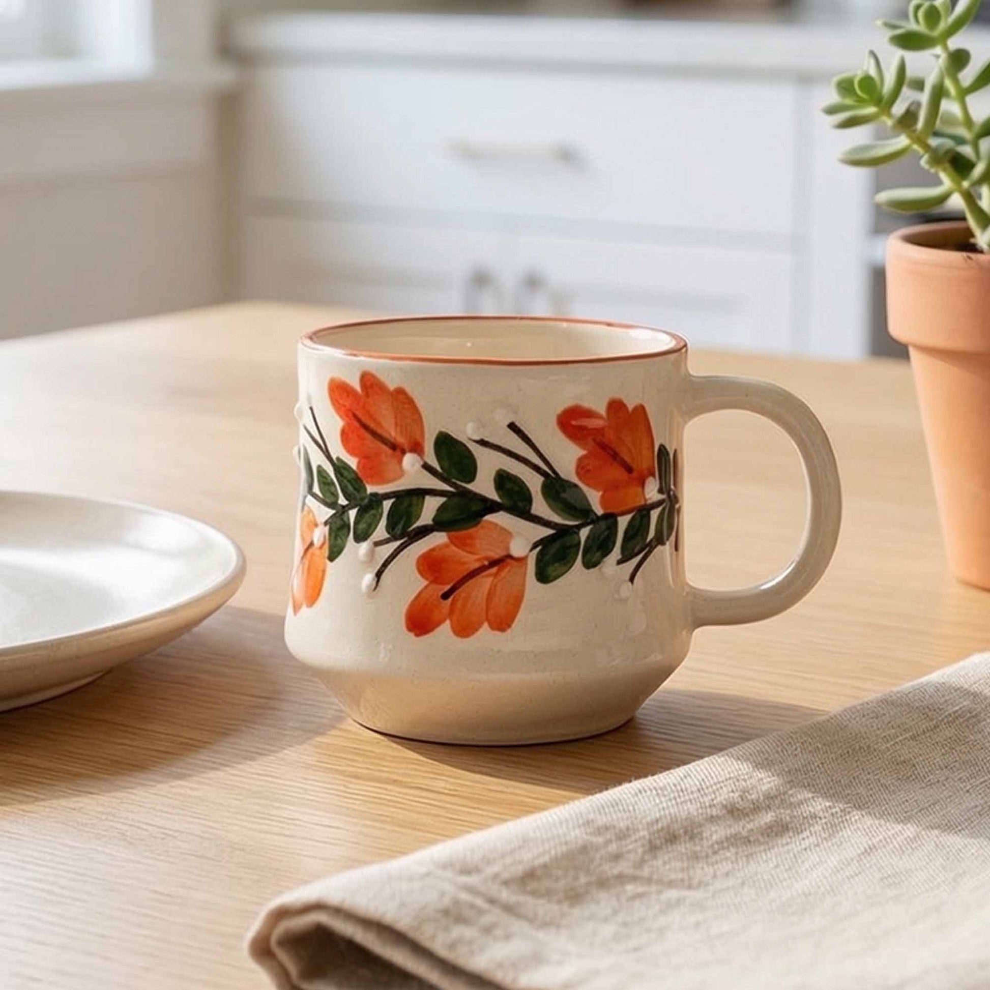 Ceramic mug with floral design on a wooden table