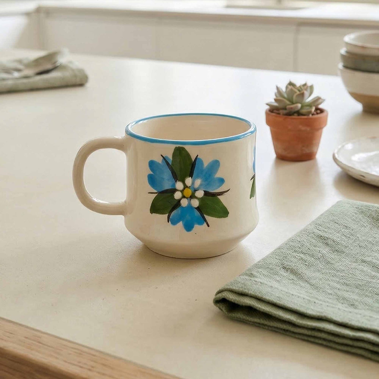 Ceramic mug with floral design on a kitchen counter