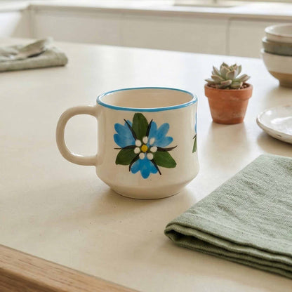 Ceramic mug with floral design on a kitchen counter