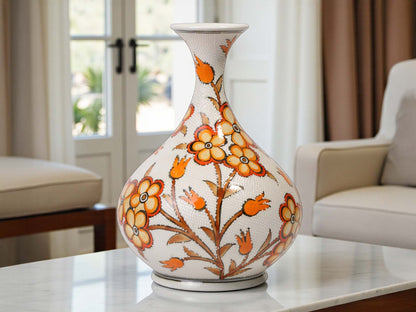 Decorative vase with floral patterns on a table in a living room setting