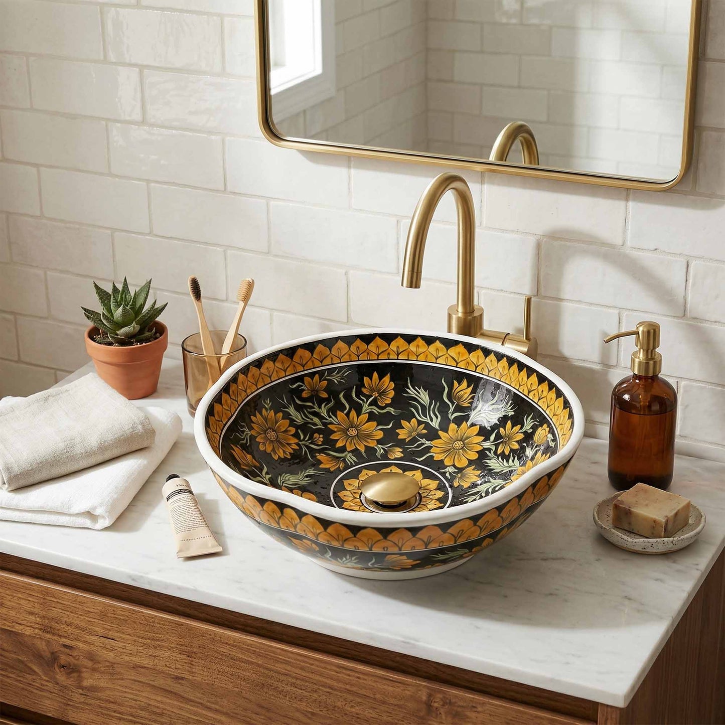 Decorative floral-patterned ceramic sink in a bathroom setting with a mirror and toiletries.