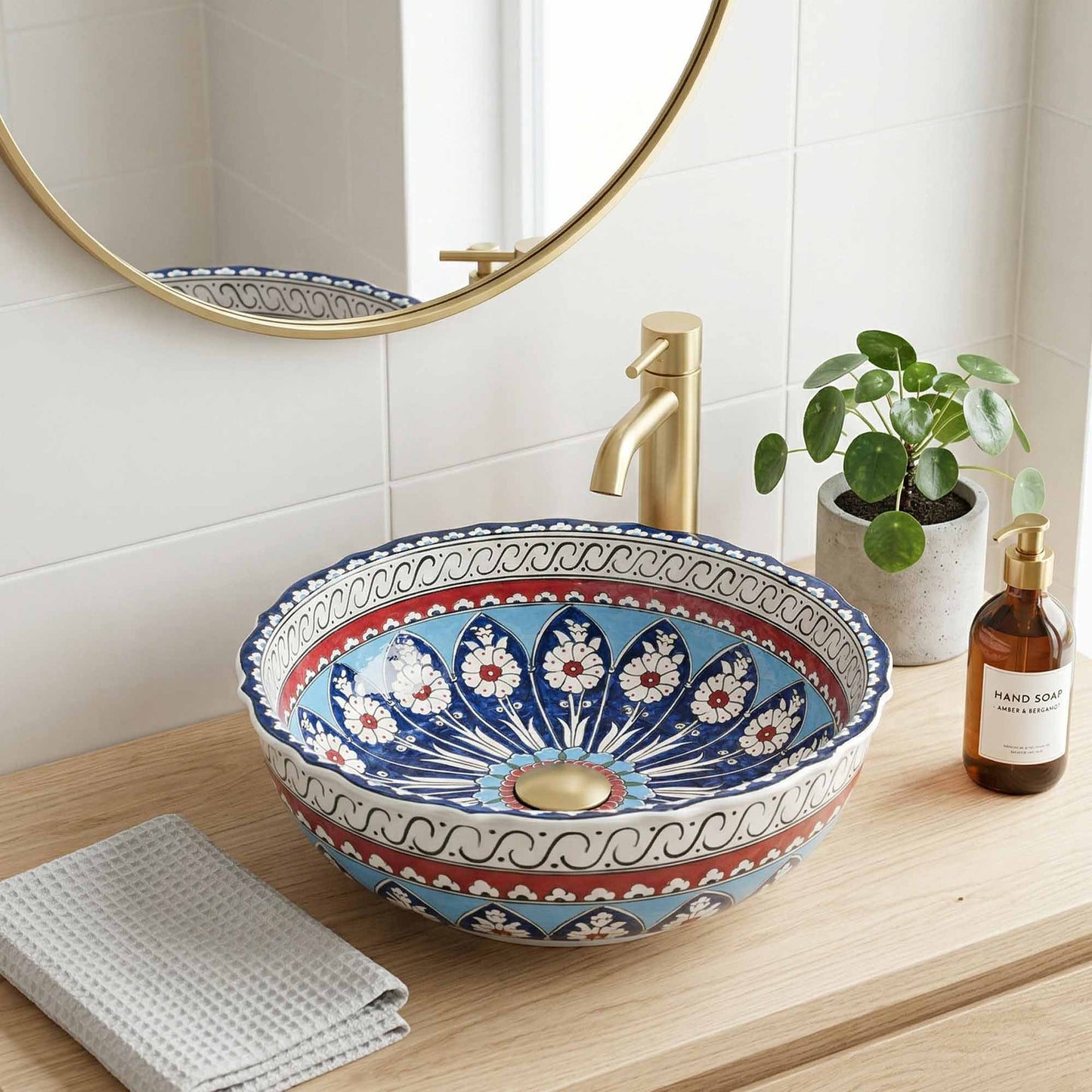 Decorative bathroom sink with floral patterns on a wooden countertop.
