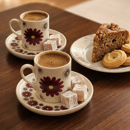 Two cups of coffee with pastries on a wooden table