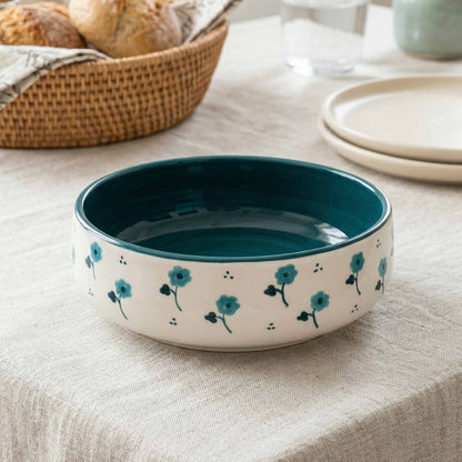 Ceramic bowl with floral design on a tablecloth