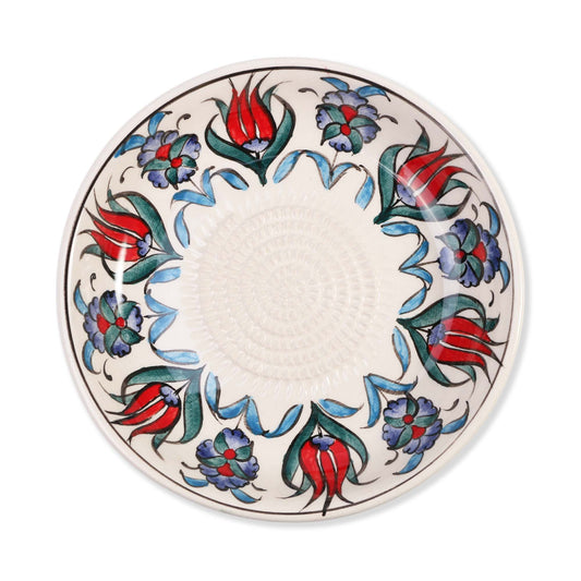 Ceramic garlic grater bowl with floral design on a white background