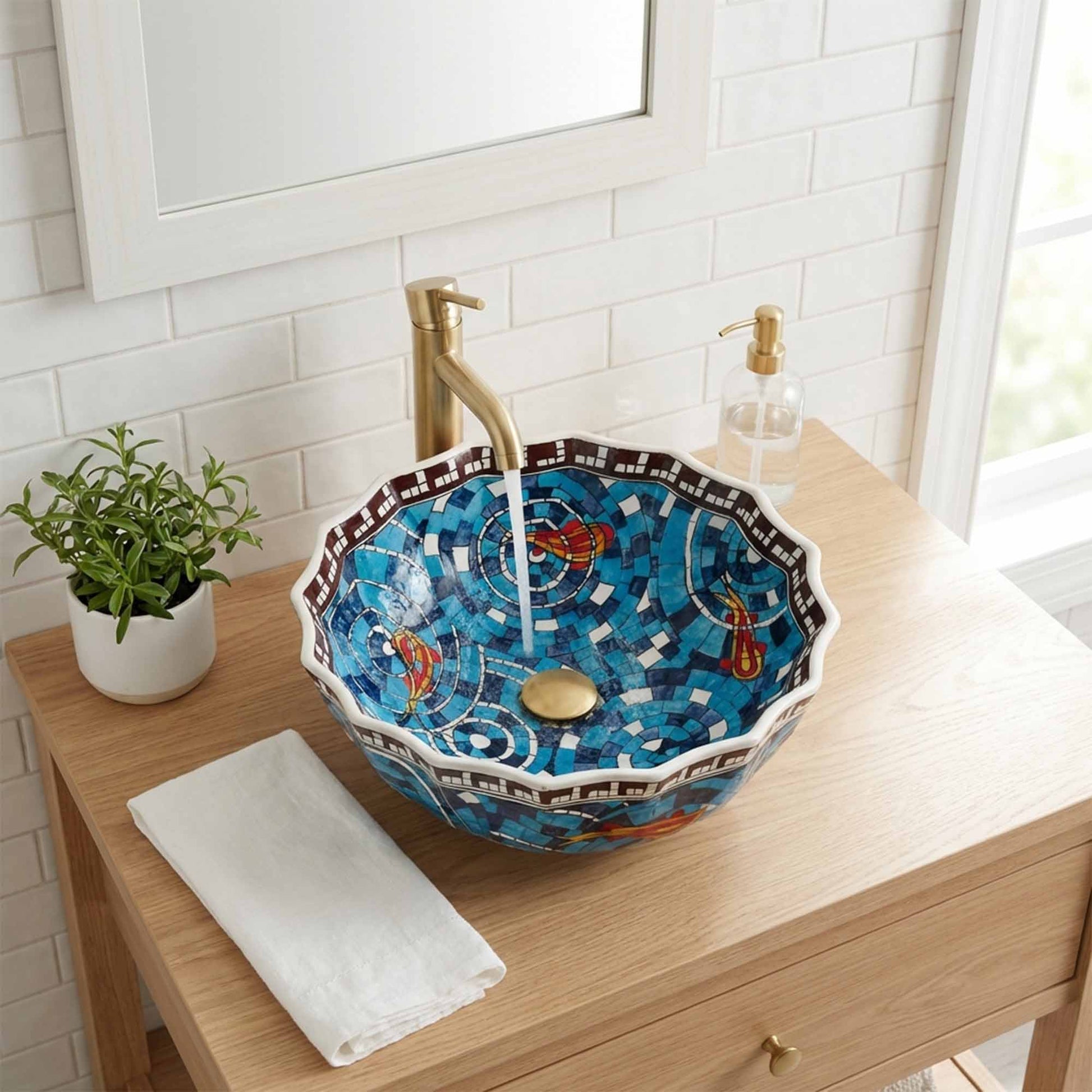 Decorative ceramic sink on a wooden vanity with a plant and soap dispenser.