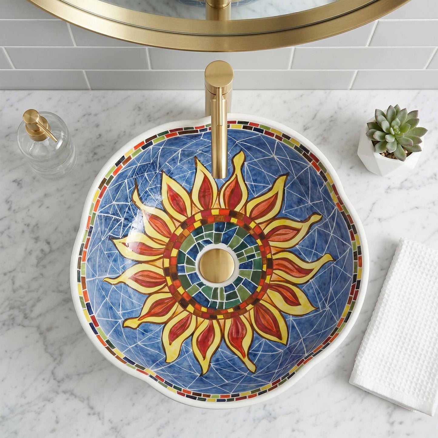 Decorative ceramic sink with sunflower design on a marble countertop