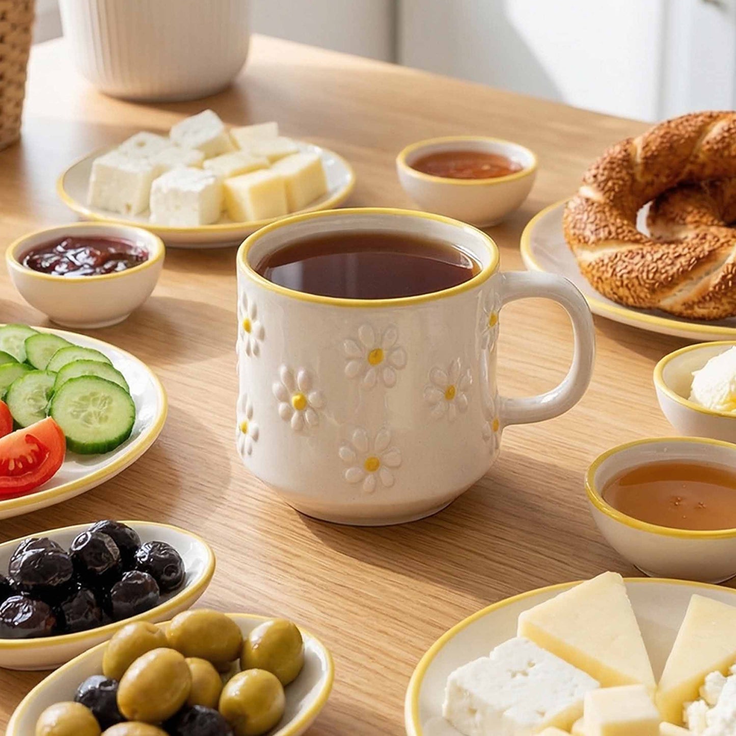 Cup of tea on a wooden table with various snacks and appetizers.