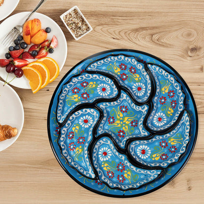 Decorative snack serving tray set with floral design on a wooden table with breakfast items.