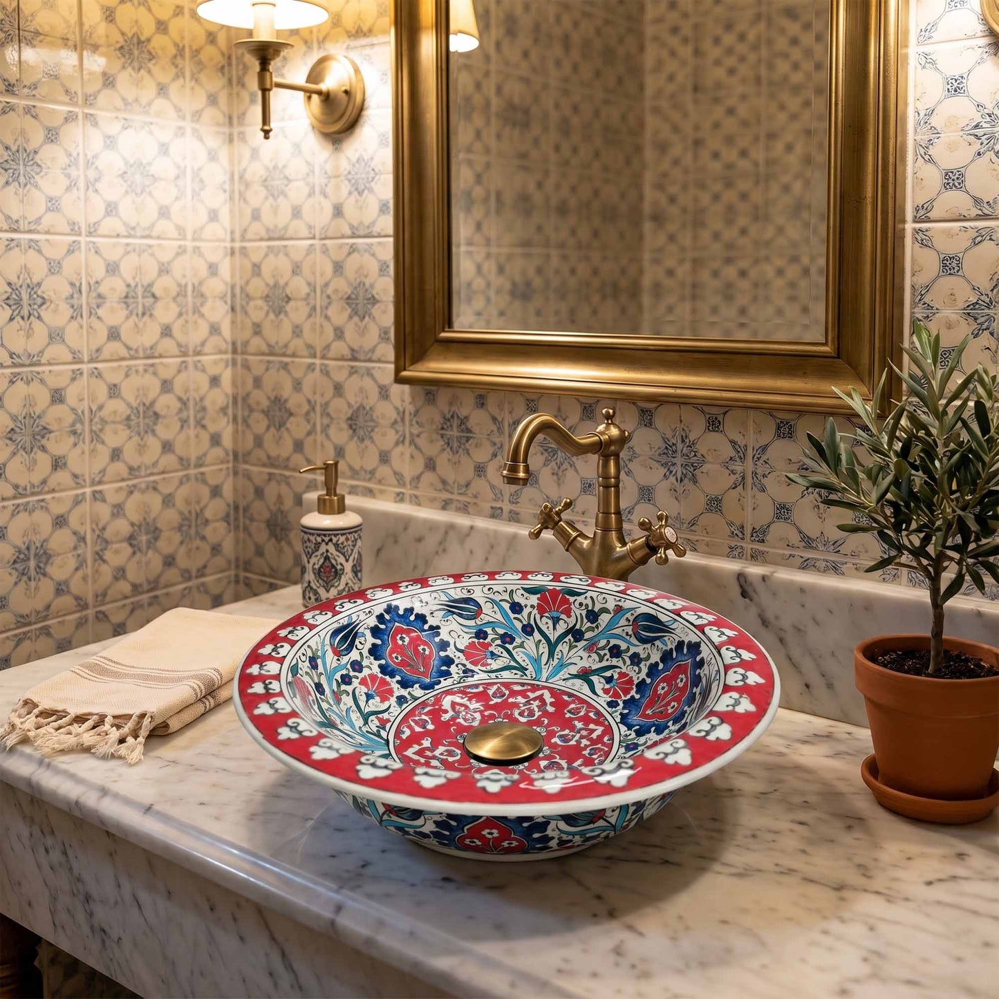 Decorative ceramic sink with floral patterns in a bathroom setting.