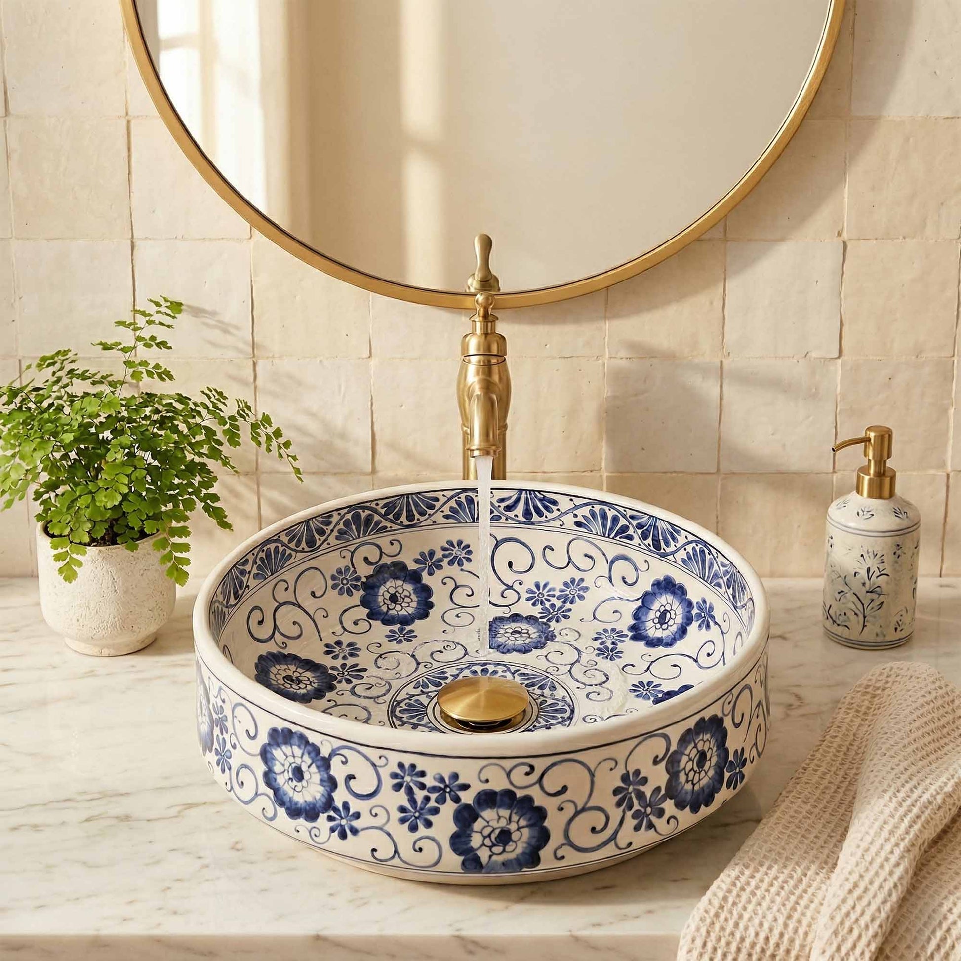 Decorative ceramic sink with blue floral patterns in a bathroom setting.