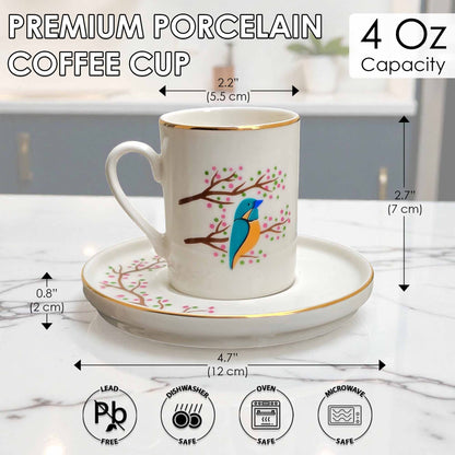 White coffee cup with blue bird design on a saucer, with measurements and safety icons displayed.