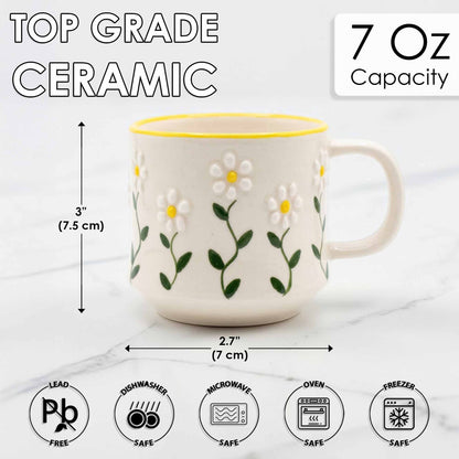 Ceramic mug with floral design and measurements on a white background