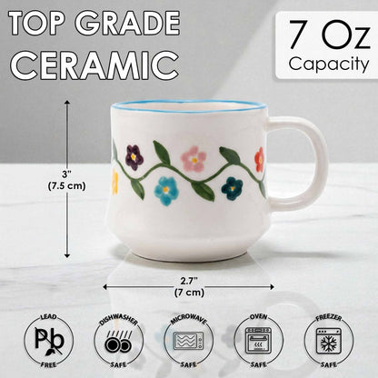 Ceramic mug with floral design and measurements on a white background