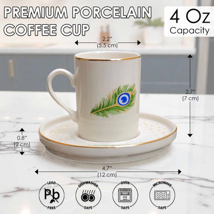 White porcelain coffee cup with peacock feather design on a saucer, with measurements and safety icons displayed.