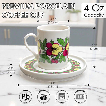 Floral-patterned coffee cup with saucer on a marble surface, with measurements and safety icons displayed.