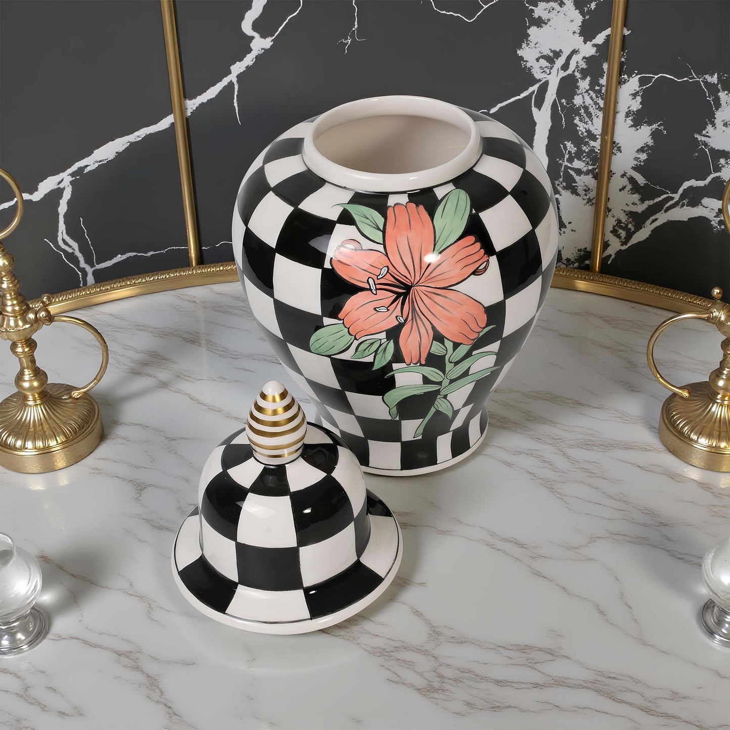Decorative jar with floral design on a checkered pattern, placed on a marble surface.