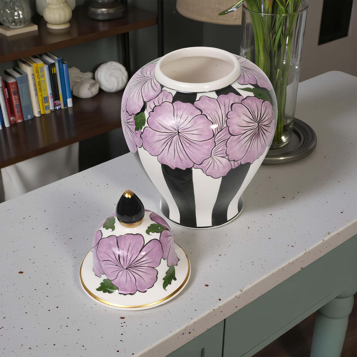 Decorative jar with floral design on a table