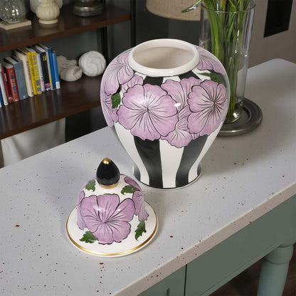 Decorative jar with floral design on a table