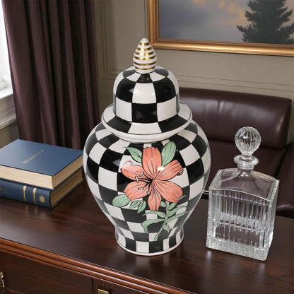 Decorative jar with black and white checkered pattern and floral design on a wooden surface.