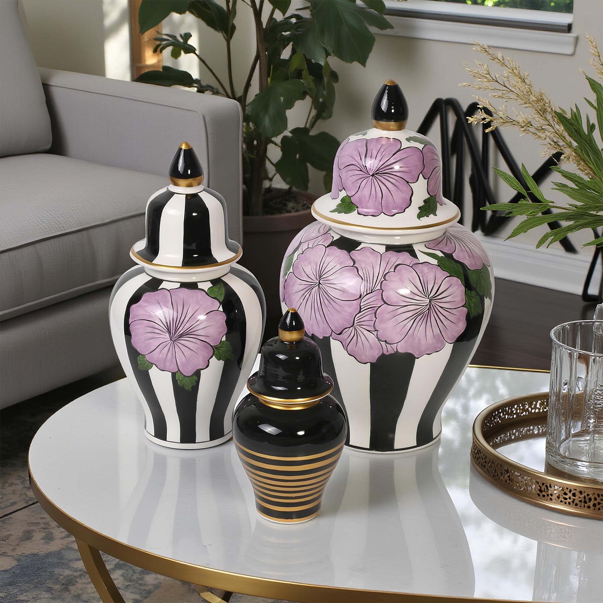 Decorative jars with floral patterns on a table in a living room setting