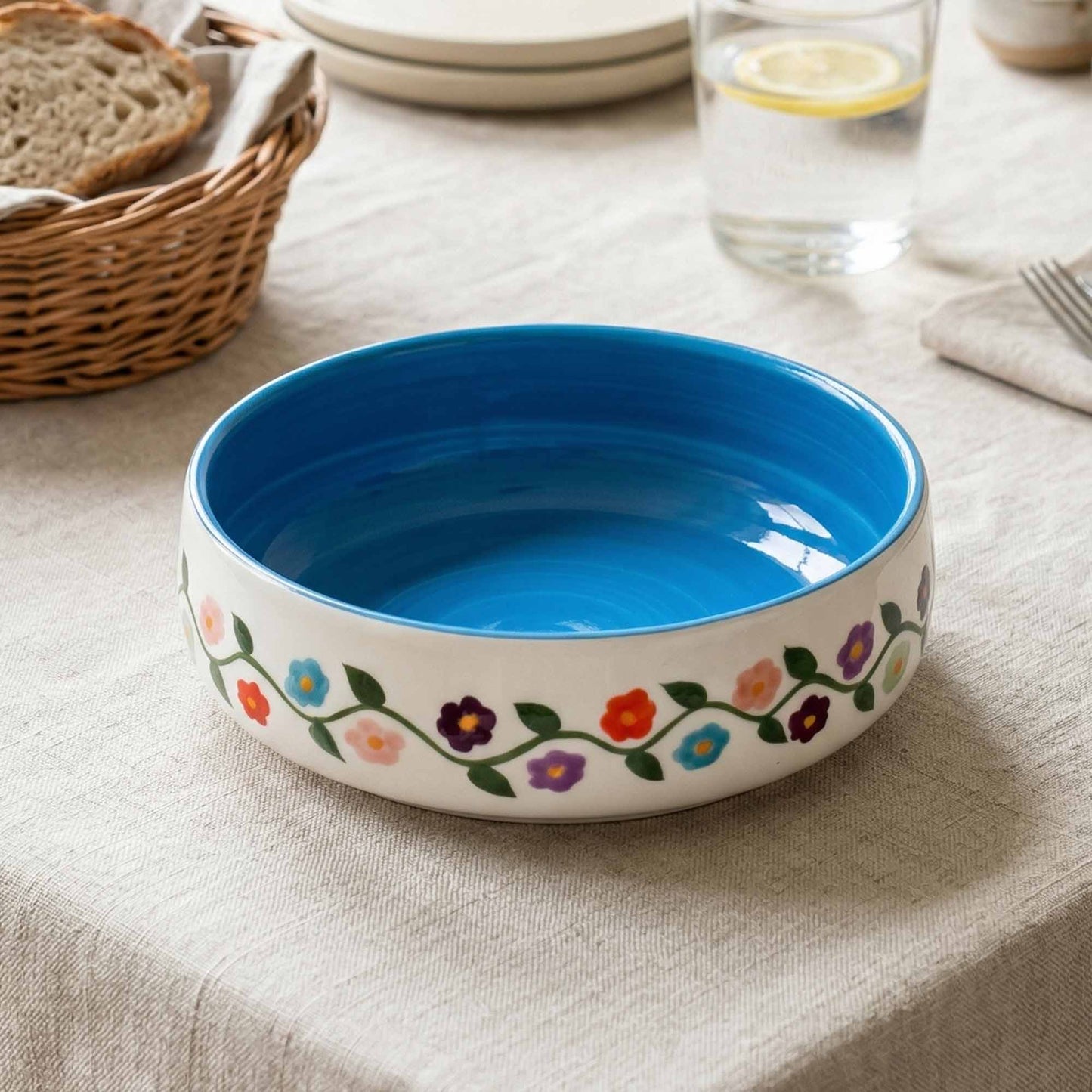 Ceramic bowl with floral design on a tablecloth