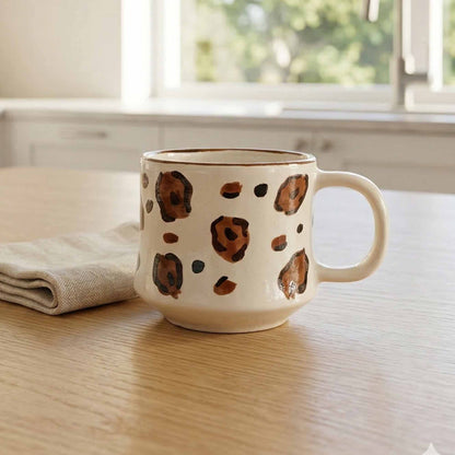 Ceramic mug with coffee seeds print design on a wooden table