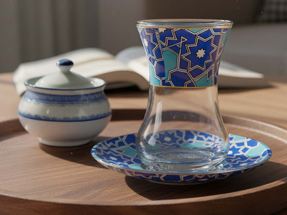 Decorative glass with blue geometric pattern on a wooden table