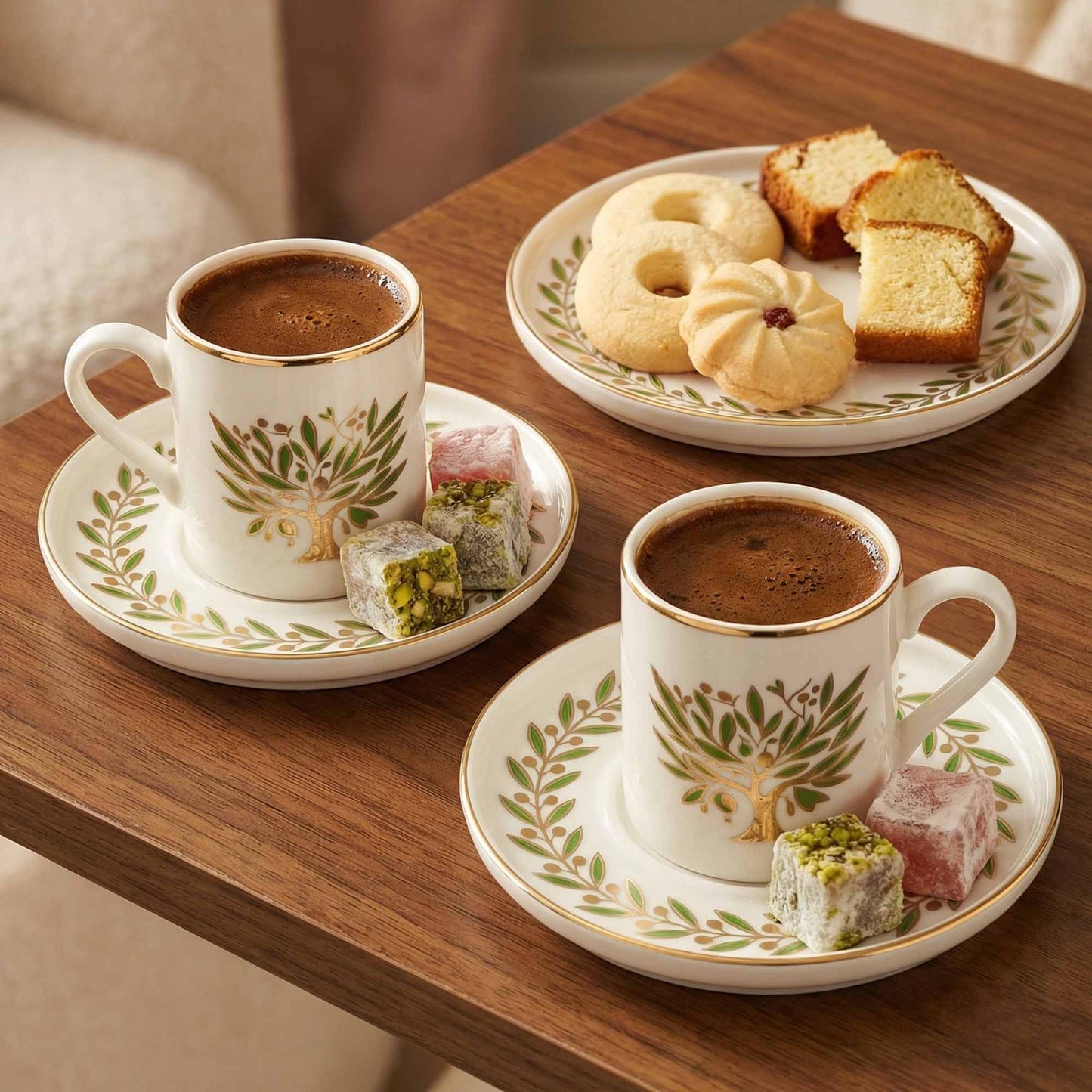 Two cups of coffee with pastries on a wooden table