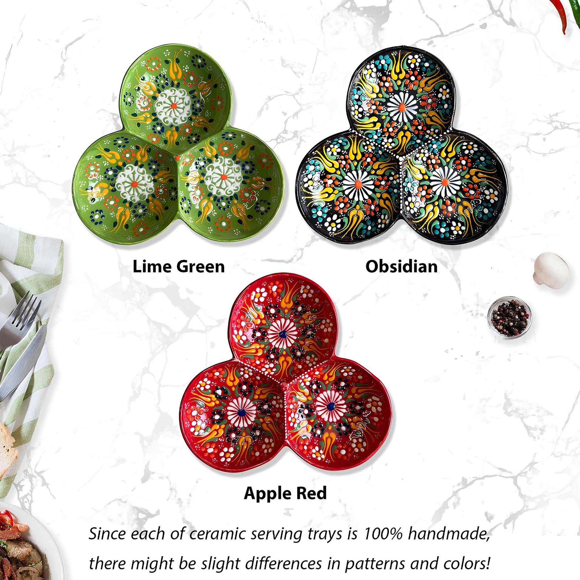 Three ceramic serving trays in Lime Green, Obsidian, and Apple Red with floral patterns on a white marble background.