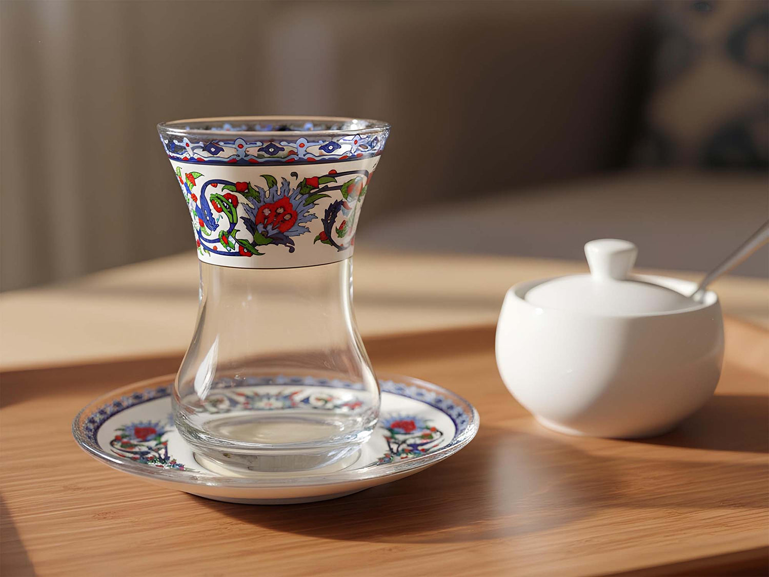 Decorative glass with floral patterns on a wooden table