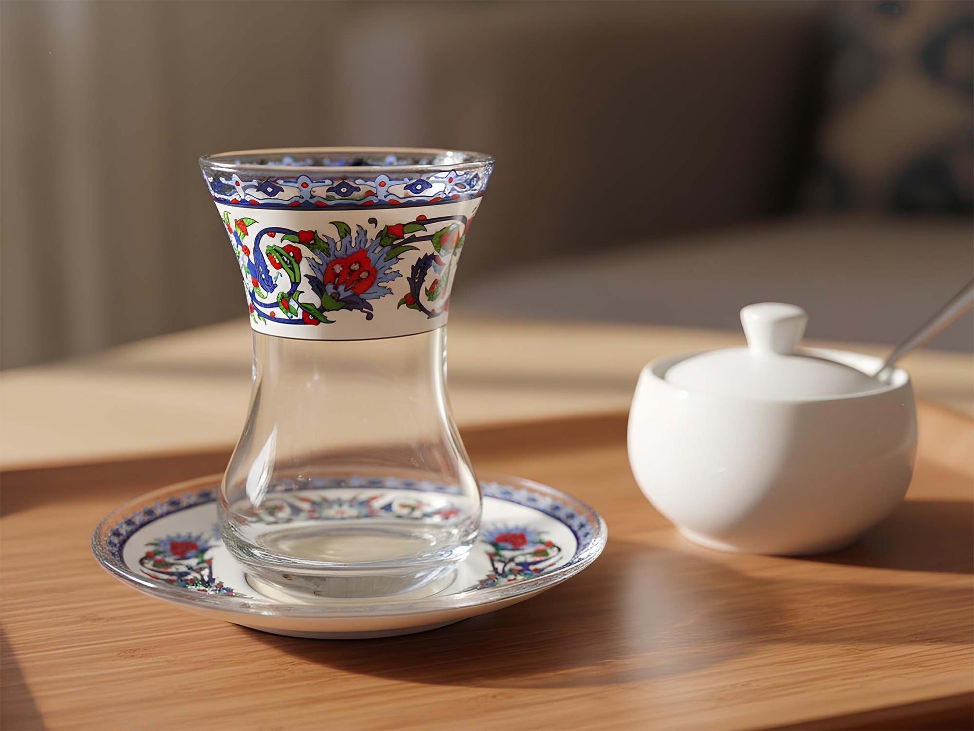 Decorative glass with floral patterns on a wooden table