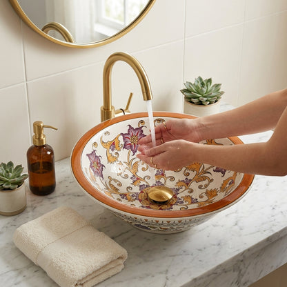 Decorative ceramic sink with floral patterns in a bathroom setting