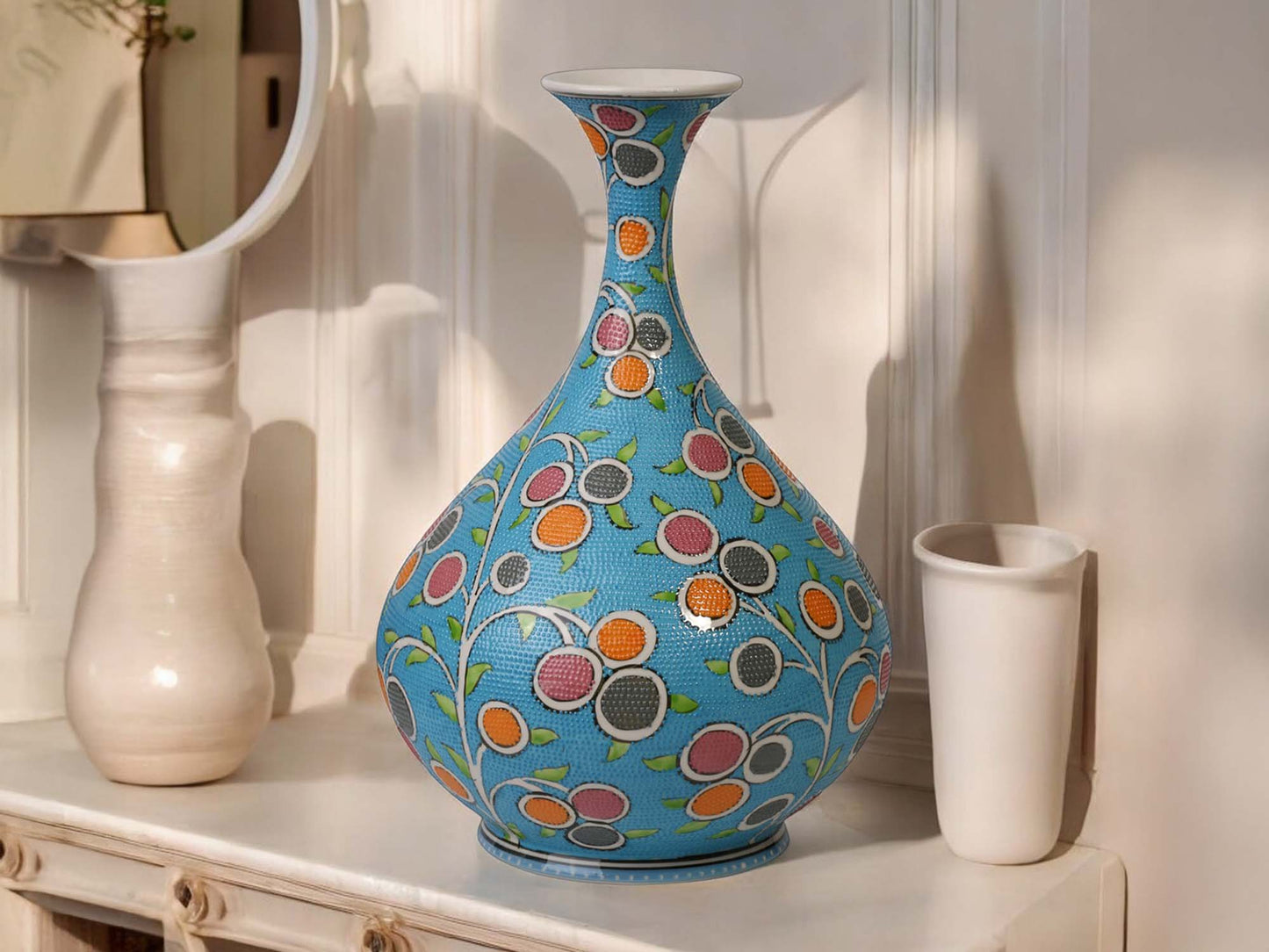 Decorative ceramic vase with floral pattern on a shelf