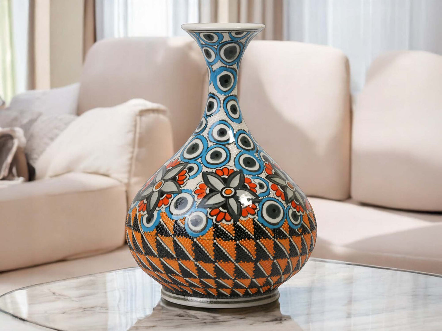 Decorative vase with geometric pattern on a marble surface in a living room setting
