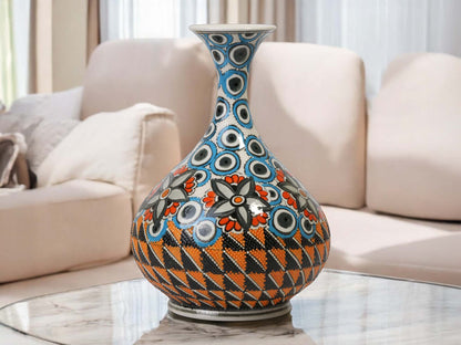 Decorative vase with geometric pattern on a marble surface in a living room setting